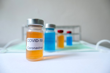 Professional doctors perform testing and analyzing samples of COVID-19 vaccines for immunization prevention and treatment from viral infections. Medical and health care concepts