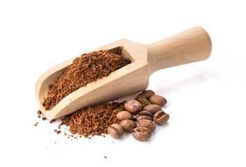 coffee powder in wood scoop isolated on white background