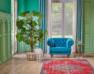 Green living room wall and white window, blue sofa, vae of big plant on the brown parquet with turquoise curtain style.