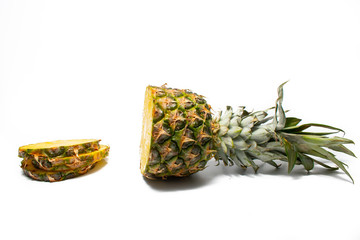 Fresh pineapple on a white background. Sliced exotic fruit waiting to be eaten.