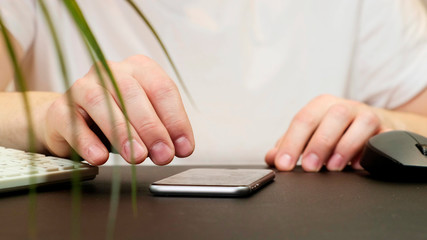 Fototapeta premium Man using his smartphone. Social network. Close up.