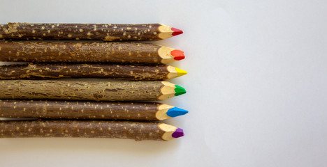 Obraz premium LGBT colors. Pencils lie on top Bright social colors lgbt. Copy space. Blank for advertising hobby drawing.