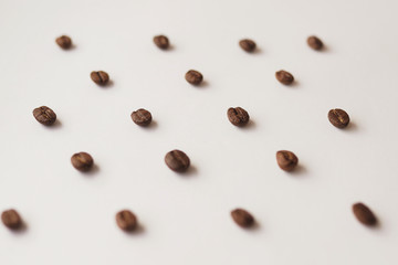 coffee beans on a white background pattern top view