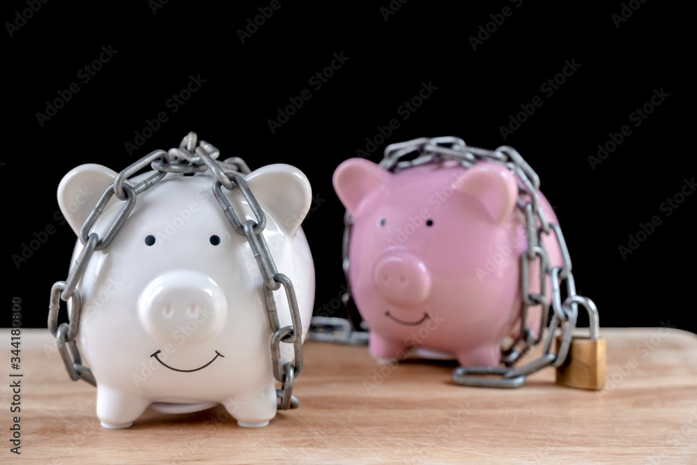 Wall mural chained piggy bank and lock money savings with chain and keys. money security concept