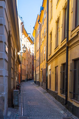 Narrow street in Stockholm. The old town (gamla stan) of the Swedish capital. Photo of medieval architecture.