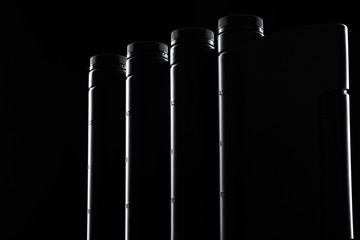 Engine oil bottle on black background.
