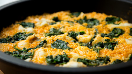 Paella with spinach and seafood