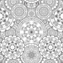 Ethnic floral mandalas, doodle background circles in vector. Seamless pattern. Black and white pattern for coloring book for adults and kids.
