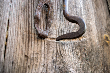 iron latch on the background of a wooden building