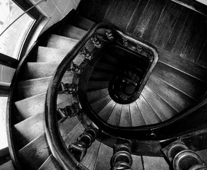 A black and white artistic view of a  spiral staircase