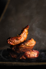 grilled meat with smoke
