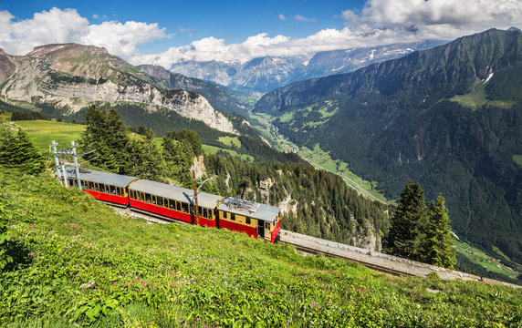 Retro passenger train moves from Schynige Platte to Interlaken. Switzerland