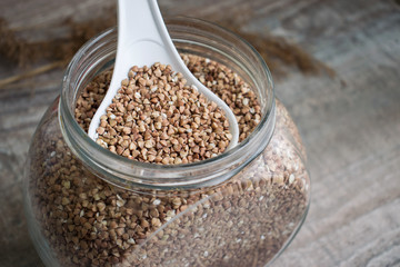 jar with buckwheat closeup on the table