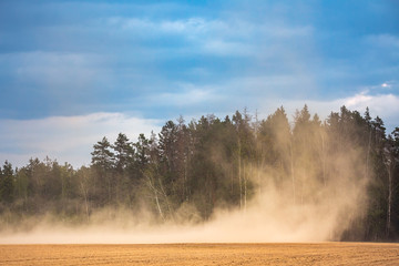 Dust storm in dry fields, dry weather infuenced by climate change