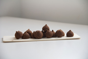 Chocolate truffle candie. Minimal concept above decoration on white food background. Chocolate Candy,