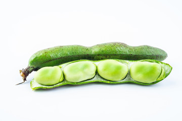 Closeup of fresh broad beans peeled on white background