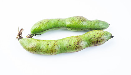 Fresh broad bean pods on white background