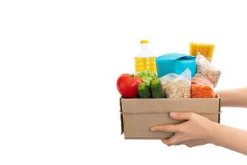 Food donation box in hands, woman's. Isolated banner for website. Isolated on white background.