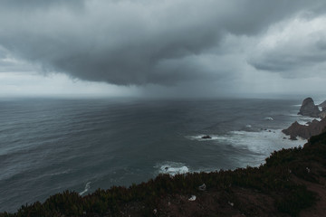 Storm in Atlantic ocean, Cabo da Roca, Portugal. Dark clouds above the sea.