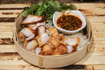 Deep Fried Crispy Pork Belly Cooked with Garlic and spicy dipping sauce.