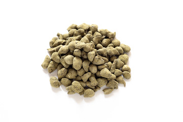  traditional chinese ginseng tea,  green dry tea leaf for a fragrant hot drink, chinese pressed tea, dry tea leaf isolate on white background