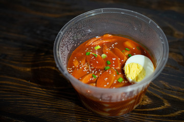 Take out Korean food Stir-fried Rice Cake Tteok-bokki in microwaveable container.
