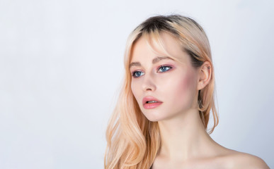 Fototapeta premium Sad blonde girl with dark natural roots.