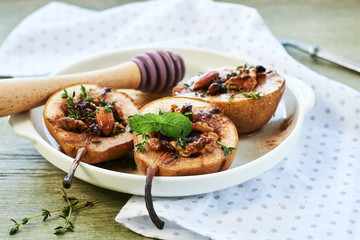 Baked pears with nuts, raisins, honey and cinnamon.