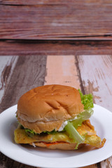 Egg burger on wooden background
