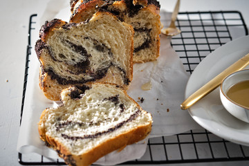 Swirl brioche with poppy seeds. Easter bread. Poppy seed braided or roll bread, Babka. Traditional Polish sweet Christmas bread.