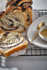 Swirl brioche with poppy seeds. Easter bread. Poppy seed braided or roll bread, Babka. Traditional Polish sweet Christmas bread.