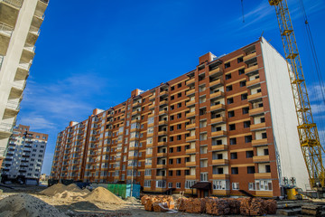 construction process huge building long exterior facade industrial dirty area and crane,...