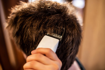 Hair cutting with a hair clipper at home