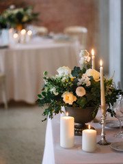 wedding decor, served tables, ivory, with candles, glasses, beautiful wooden tables, inside the Italian old Villa
