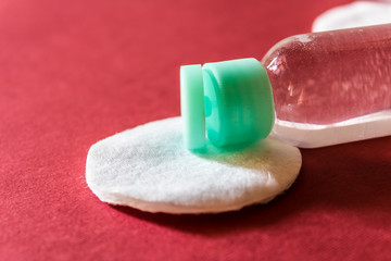 Micellar water and cotton disk for make-up removing, cleansing facials and beauty procedures concept - Image