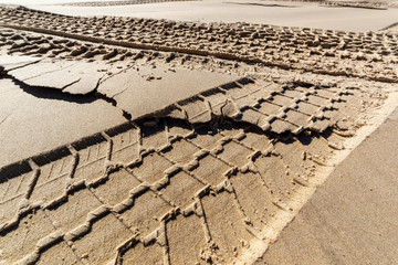 Traces Of Tires On The Sand