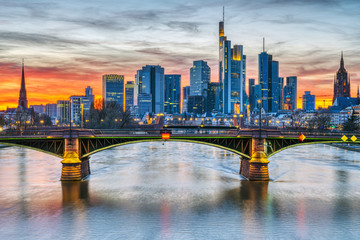 The skyscrapers of Frankfurt in Germany and the Main river after sunset