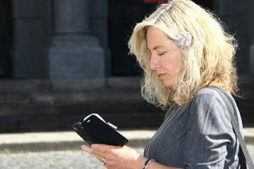 attractive woman with cellphone, reading and writing,