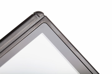 Black pocket game console blank screen edge, corner, display closeup, handheld gaming abstract background, copy space. Portable gaming device with screen turned off macro shot, white background © Tomasz