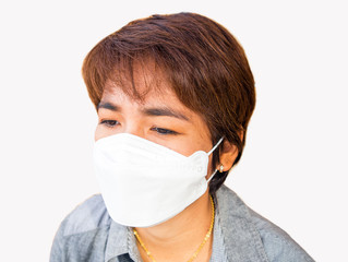 Asian female with protective face mask.