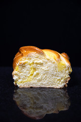 loaf of bread  with reflection  on black background 