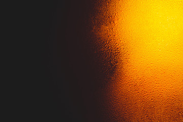 Fototapeta na wymiar Texture of water drops on the bottle of beer,Macro beer surface