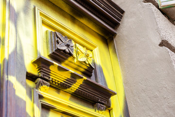 Vandalised, spray painted antique old wooden door detail, destroyed dated architecture, urban...