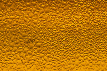 Close up view of the ice cubes in dark cola background. Texture of cooling sweet summer's drink with foam and macro bubbles on the glass wall. Fizzing or floating up to top of surface