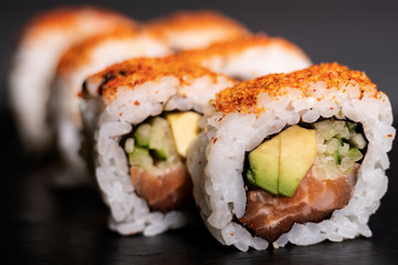 Salmon roll with avocado, sushi ready to eat