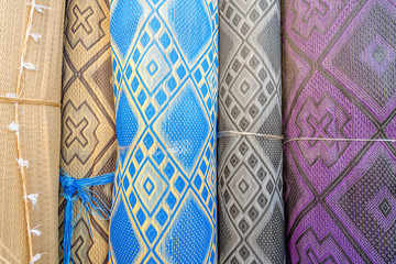 Many rolls of plastic carpet sold on African open air market in Agadir, Morocco