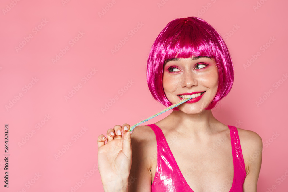 Poster Image of joyful beautiful woman smiling while stretching marmalade