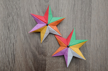 two holiday origami stars, top view