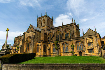 Fototapeta na wymiar The vivid colours of Sherborne Abbey show in this photograph taken on a bright sunny day in April.