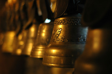 Row of brass bells, controlled blur